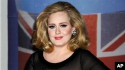 FILE - Adele arrives for the Brit Awards.