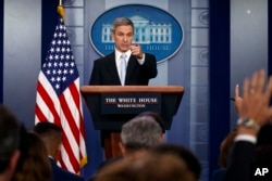 Acting Director of United States Citizenship and Immigration Services Ken Cuccinelli, speaks during a briefing at the White House, Monday, Aug. 12, 2019, in Washington. (AP Photo/Evan Vucci)