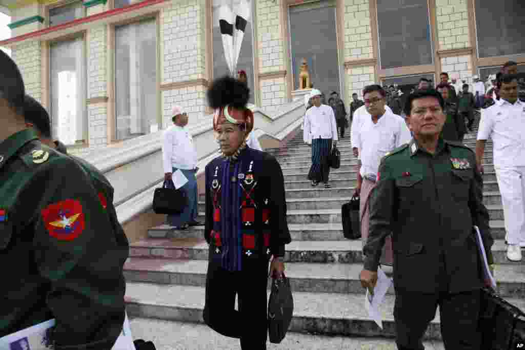 Military representatives and lawmakers arrive to attend a regular session of the lower house of Parliament, Tuesday, Aug. 18, 2015, in Naypyitaw, Myanmar. Myanmar&#39;s parliament reopened Tuesday for its final session before November&#39;s national elections, with the spotlight on the influential speaker &mdash; who was violently ousted just days ago as head of the military-backed ruling party. (AP Photo/Khin Maung Win)