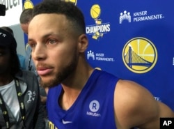 Golden State Warriors Stephen Curry takes questions from the media after NBA basketball practice in Oakland, California, Sept. 23, 2017.