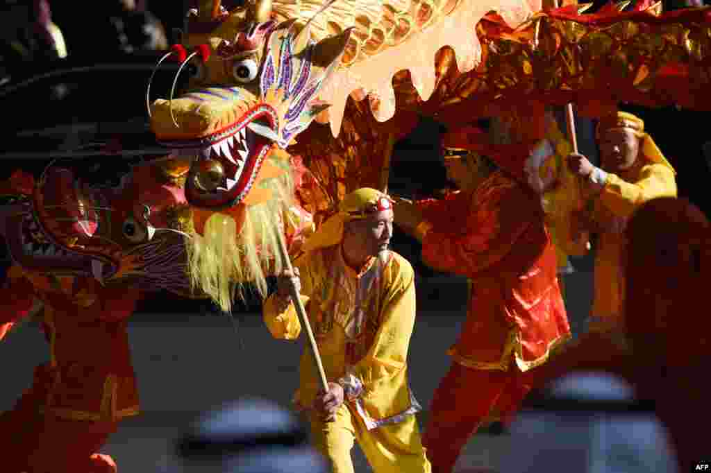 Chinese traditional dance teams perform during the inauguration ceremony of the Yanbu Aramco Sinopec Refining Company (YASREF) project in Riyadh.