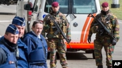 Belgian police men and soldiers secure the area outside Zaventem Airport in Brussels, March 29, 2016. 
