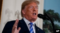 President Donald Trump delivers a statement on the Iran nuclear deal from the Diplomatic Reception Room of the White House, May 8, 2018, in Washington. 