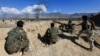 Afghan security forces take position during a gun battle between Taliban and Afghan security forces in Laghman province, Afghanistan, March 1, 2017.