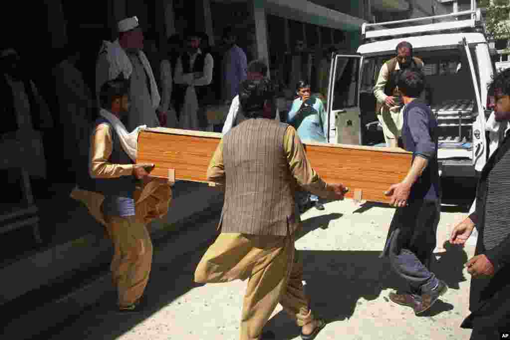 Afghans carry a coffin of the body of a woman who was killed by gunmen in the city of Jalalabad, east of Kabul.&nbsp;Attackers gunned down three women working to administer the anti-polio vaccine in eastern Afghanistan, officials said.