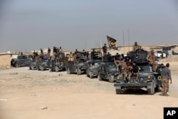 FILE - Iraq's elite counterterrorism forces gather outside Irbil, Iraq, Oct. 15, 2016.