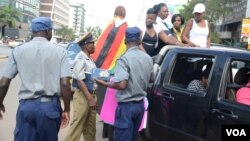 Police in Zimbabwe block protesters demanding the return of women stranded in Kuwait. (Photo: Mavis Gama)