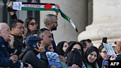 Palestinians from Gaza, who were received by Pope Francis earlier in the morning, attend his general audience in Saint Peter Square at the Vatican on November 22, 2023.