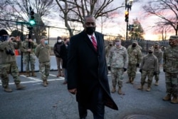 FILE - Secretary of Defense Lloyd Austin visits National Guard troops deployed at the U.S. Capitol and its perimeter, Jan. 29, 2021 on Capitol Hill in Washington.