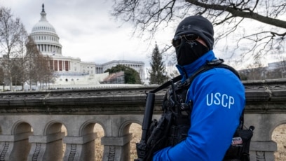 FILE - A United States Capitol Police officer stands guard on the grounds of the US Capitol building in Washington, Jan. 2, 2025. At least 14 people were killed and 30 injured on Jan. 1 when a vehicle plowed into a New Year's crowd in New Orleans. 