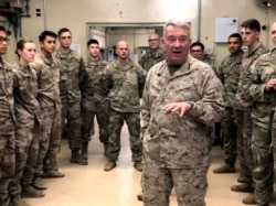 FILE - Marine General Kenneth "Frank" McKenzie, head of U.S. Central Command, speaks with U.S. troops while visiting Forward Operating Base Fenty in Jalalabad, Afghanistan, Sept. 9, 2019.