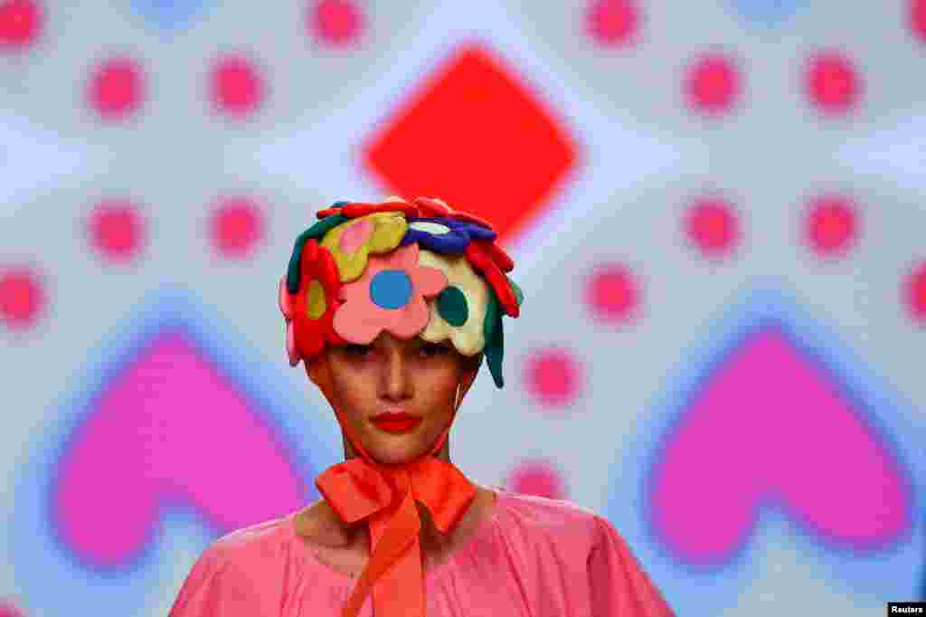 A model displays an outfit created by Agatha Ruiz de la Prada during the Mercedes Benz Fashion Week, in Madrid, Spain.