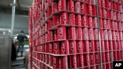 FILE - Pallets of branded aluminum cans at the production line in the Palestinian Chat Cola bottling plant, in the West Bank city of Salfit, Feb. 13, 2025. 