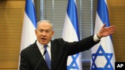 In this Nov. 20, 2019 photo, Israeli Prime Minister Benjamin Netanyahu speaks during an extended meeting of the right-wing bloc members at the Knesset, in Jerusalem. 