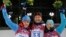 9일 러시아 소치 올림픽 여자 바이애슬론 7.5km 스프린트 종목에서 우승을 차지한 슬로바키아의 아나스타샤 쿠즈미나(가운데)가 은메달을 딴 러시아의 올가 필루키나(왼쪽), 동메달을 딴 우크라이나의 비나 에메렌코와 메달 시상대에서 기뻐하고 있다.