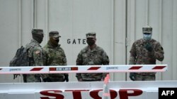 (FILES) In this file photo taken on January 08, 2021 National Guard soldiers provide security around the US Capitol in Washington, DC, on January 8, 2021