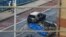 Debris and a burned out car are pictured at the scene of a helicopter crash in central London, on January 16, 2013.