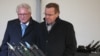 FILES - CEO of Rheinmetall Armin Papperger and German Defense Minister Boris Pistorius look at ammunition at the future site of a factory in Unterluess, Germany, Feb. 12, 2024. CNN reported on July 11, 2024, that Papperger was the target of an alleged Russian assassination plot.