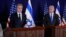 Israeli Prime Minister Benjamin Netanyahu (R) looks on as US Secretary of State Antony Blinken gives statements to the media inside The Kirya, which houses the Israeli Defence Ministry, after their meeting in Tel Aviv on October 12, 2023.