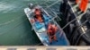台湾海岸巡防署人员2024年6月9日在接近台北的淡水河沿岸逮捕了一名阮姓中国男子，并登上此人驾驶的快艇。（台湾海巡署照片）