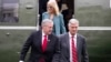 FILE - Mark Meadows, left, Robert O'Brien and Kellyanne Conway step off Marine One, March 28, 2020, in Washington. The three were named in a watchdog report that found 13 Trump administration members had willfully violated the Hatch Act.