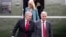 FILE - Mark Meadows, left, Robert O'Brien and Kellyanne Conway step off Marine One, March 28, 2020, in Washington. The three were named in a watchdog report that found 13 Trump administration members had willfully violated the Hatch Act.
