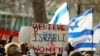 FILE - Demonstrators gather outside U.N. headquarters in New York, Dec. 4, 2023. Israeli women and legal activists criticized international rights groups' response to reports of alleged sex crimes committed by Hamas militants during the October 7 attacks.