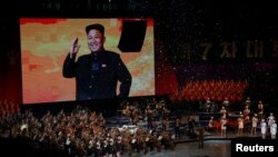 A picture of the North Korean leader Kim Jong Un appears on the big screen during a celebratory concert marking the end of the 7th Workers' Party Congress in Pyongyang.