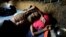 A Rohingya refugee man lies at his shelter in Kutupalong refugees camp in Cox's Bazar, Bangladesh, Oct. 20, 2017.