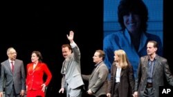 George C. Wolfe , Maura Tierney, and Tom Hanks, with an image of Nora Ephron behind them on a large screen, at the "Lucky Guy" opening night, April, 1, 2013 in New York, NY. 