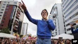 Presidential candidate Guillermo Lasso speaks during a rally outside the National Electoral Council in Quito, Ecuador, Monday, April 3, 2017. 