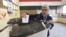 A woman casts her vote at a polling station during the second round of parliamentary elections in the Shubra area of Cairo, Nov. 22, 2015. 