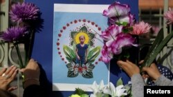 A picture of Jakelin Caal, a 7-year-old Guatemalan girl who died in U.S. custody after crossing illegally from Mexico to the U.S., is seen during a protest held to demand justice for her in El Paso, Texas, Dec. 15, 2018. 