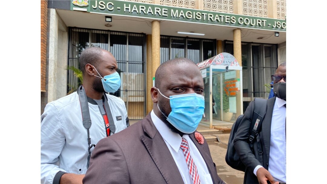 Paidamoyo Saurombe, from Zimbabwe Lawyers for Human Rights, talks to reporters outside Harare Magistrate's Court, Jan. 14, 2021. (Columbus Mavhunga/VOA)