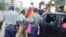 Police in Zimbabwe block protesters demanding the return of women stranded in Kuwait. (Photo: Mavis Gama)