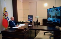 Russian President Vladimir Putin attends a cabinet meeting via teleconference at the Novo-Ogaryovo residence outside Moscow Moscow, Russia, May 22, 2020.