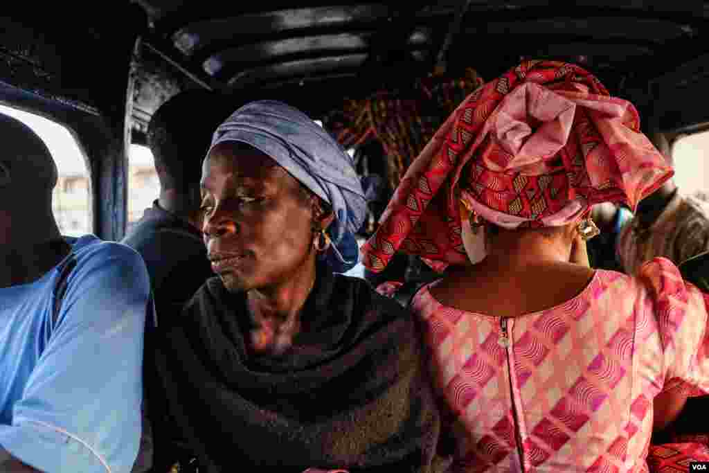 Passengers ride in a car rapide in Dakar, Senegal. (R. Shryock/VOA)