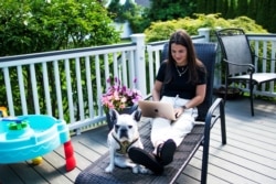 Stephanie Ellis uses her laptop at her home in Marlboro, New Jersey, June 19, 2020.