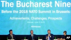 From left, speaker of the Chamber of Deputies of the Czech Republic Radek Vondracek, Romania's President Klaus Iohannis, Poland's President Andrzej Duda, and Estonia's President Kersti Kaljulaid attend a discussion on NATO, in Warsaw, Poland, June 8, 2018