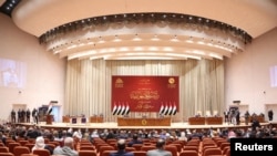 FILE - Iraqi lawmakers attend a parliamentary session to vote for a new head of state president in Baghdad, Iraq, October 13, 2022. Iraqi Parliament Media Office/Handout via REUTERS 