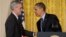 President Barack Obama shakes hands with current Deputy National Security Adviser Denis McDonough after he announced he will name McDonough as his next chief of staff, in the East Room of the White House in Washington, January 25, 2013. (AP)