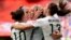 United States forward Abby Wambach (20) is congratulated by midfielder Carli Lloyd (10) and forward Alex Morgan (13)\ after scoring against Nigeria during the first half in a Group D soccer matc, June 16, 2015.