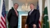 Secretary of State Mike Pompeo stands with Pakistani Foreign Minister Shah Mehmood Qureshi at the Department of State in Washington, Jan. 17, 2020.