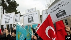 Members of a pro-Islamic party shout slogans against France and French President Nicolas Sarkozy outside the French Embassy in Ankara, Turkey, December 21, 2011