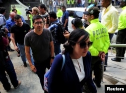 Family members arrive at the National Institute of Legal Medicine and Forensic Sciences, after the bodies of two Ecuadorean journalists and their driver, killed two months ago while being held captive by Colombian insurgents, have been found and identified, in Cali, Colombia, June 25, 2018.