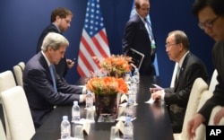 U.S. Secretary of State John Kerry, left, and United Nations Secretary-General Ban Ki-moon meet on the sidelines of the COP 21 United Nations conference on climate change, in Le Bourget, on the outskirts of Paris, Dec. 11, 2015.
