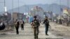 Afghan security personnel are seen at the site of bomb explosion in Kabul, Afghanistan, Feb. 26, 2020. 