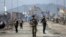 Afghan security personnel are seen at the site of bomb explosion in Kabul, Afghanistan, Feb. 26, 2020. 