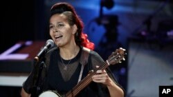 FILE - Rhiannon Giddens performs during the Americana Honors and Awards show in Nashville, Tennessee, Sept. 13, 2017.