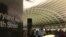 FILE - A tourist consults a map of the D.C. metro system while waiting for a train at the L'Enfant Plaza metro stop, Aug. 9. 2016. (K. Maddux/VOA)
